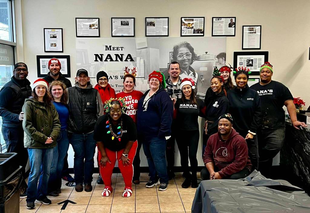 Christmas Day free meal event volunteers inside Nanas Southern Kitchen. Owner Todd Minor is at the far left, just behind Kent City Councilmember Zandria Michaud. COURTESY PHOTO, Nanas Southern Kitchen