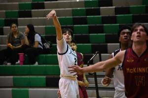 Sophomore Brandon Tagle holds the finish on a three pointer. Ben Ray / The Reporter