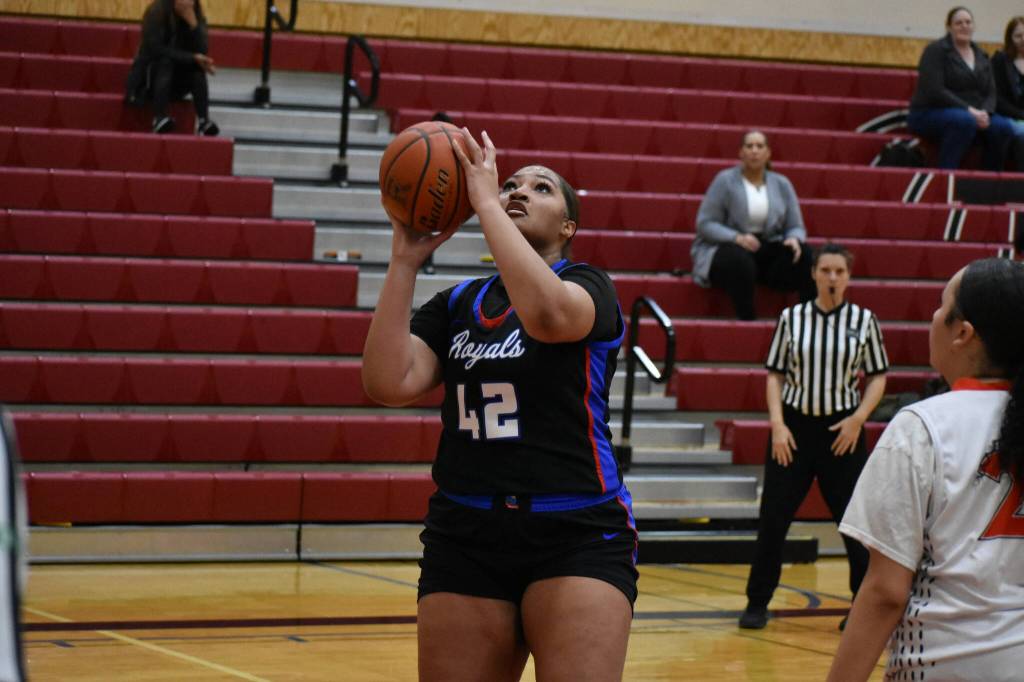 Senior Cymone Blowe takes a lay-up attempt in the first quarter. Ben Ray / The Reporter