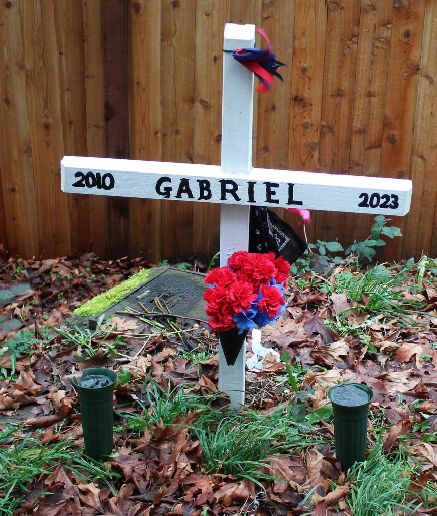 A cross marks the spot where Gabriel Coury, 12, was hit and killed by a vehicle on July 11, 2023 along 132nd Avenue SE near SE 231st Way. STEVE HUNTER, Kent Reporter