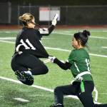 Kamalu Kagawa goes airborne after a Kentridge player grabs her flag.