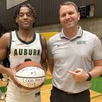 Auburn High Schools Jaylen Petty, left, with coach Ryan Hansen. Courtesy photo