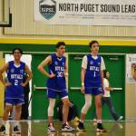 Kent-Meridian players Welsh Verano (2), George Lewis (20), Tyler Lopez (1), and Steven Lance-Garcia (20) await Kentwood in their first game.