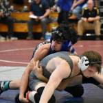 Kent-Meridian wrestler works in his opening match of the day at Todd Beamer. Ben Ray / The Reporter