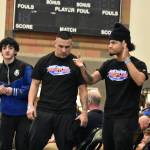 Kent-Meridian coaches celebrate a match win at Todd Beamer High School. Ben Ray / The Reporter