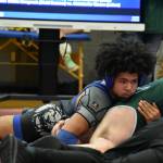 Royal 165-pound wrestler Jessie Neff pins his opponent early in the tournament. Ben Ray / The Reporter