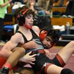 Kentlake wrestler attempts to pin his opponent from Mount Tahoma. Ben Ray / The Reporter