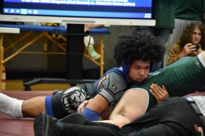 Royal 165-pound wrestler Jessie Neff pins his opponent early in the tournament. Ben Ray / The Reporter