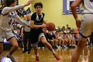 Sophomore Brandon Tagle drives to the hoop in the second half. Ben Ray / The Reporter