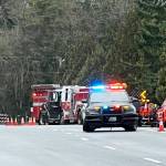 Emergency personnel respond to a single-car crash Tuesday morning, Feb. 20 along 132nd Avenue SE near Sunrise Elementary School. COURTESY PHOTO, Ernie Downes