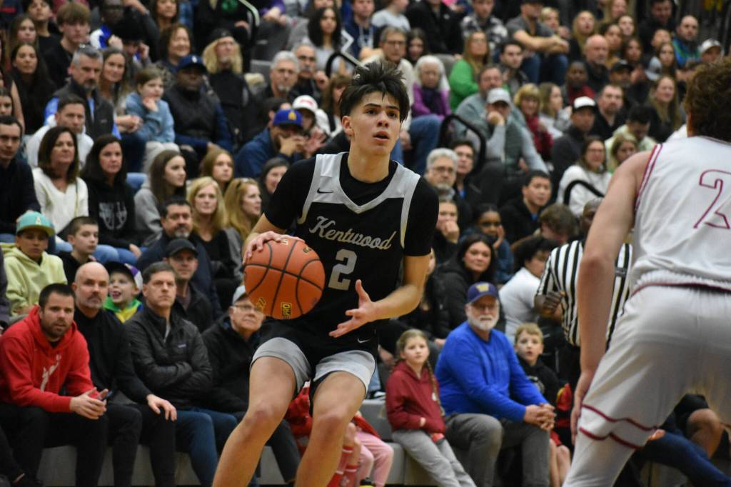 Brandon Tagle pulls up for a three pointer in transition. Ben Ray / The Reporter