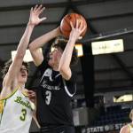 Blake Stempniak goes up for a shot attempt against the Richland Bombers. Ben Ray / The Reporter