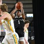 Corey Tita takes a mid-range shot against Richland. Ben Ray / The Reporter