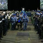 Washington State Trooper Chris Gadd is brought out by fellow troopers following a memorial ceremony on Tuesday, March 12, 2024, at Angel of the Winds Arena in Everett, Washington. (Ryan Berry / The Herald)