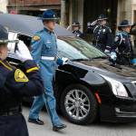 A hearse carrying Washington State Trooper Chris Gadd arrives on Tuesday, March 12, 2024, at Angel of the Winds Arena in Everett, Washington. (Ryan Berry / The Herald)
People watch as the hearse carrying Washington State Trooper Christopher Gadd passes by along Marine View Drive on Tuesday, March 12, 2024 in Everett, Washington. (Olivia Vanni / The Herald)