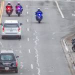 People watch as the hearse carrying Washington State Trooper Christopher Gadd passes by along Marine View Drive on Tuesday, March 12, 2024 in Everett, Washington. (Olivia Vanni / The Herald)