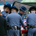 Fellow troopers carry the casket of Washington State Trooper Chris Gadd on Tuesday, March 12, 2024, during a memorial at Angel of the Winds Arena in Everett, Washington. (Ryan Berry / The Herald)