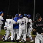 Hazen celebrates their walk-off win as Christopher Moore leaves the field. Ben Ray / The Reporter