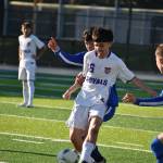 Senior Eric Sanchez battles through contact against Federal Way. Ben Ray / The Reporter