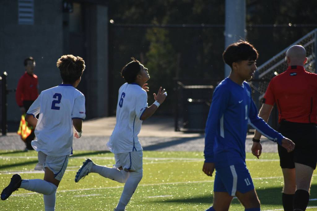Johnny Chino-Lopez points to the sky after scoring the first goal of the game. Ben Ray / The Reporter