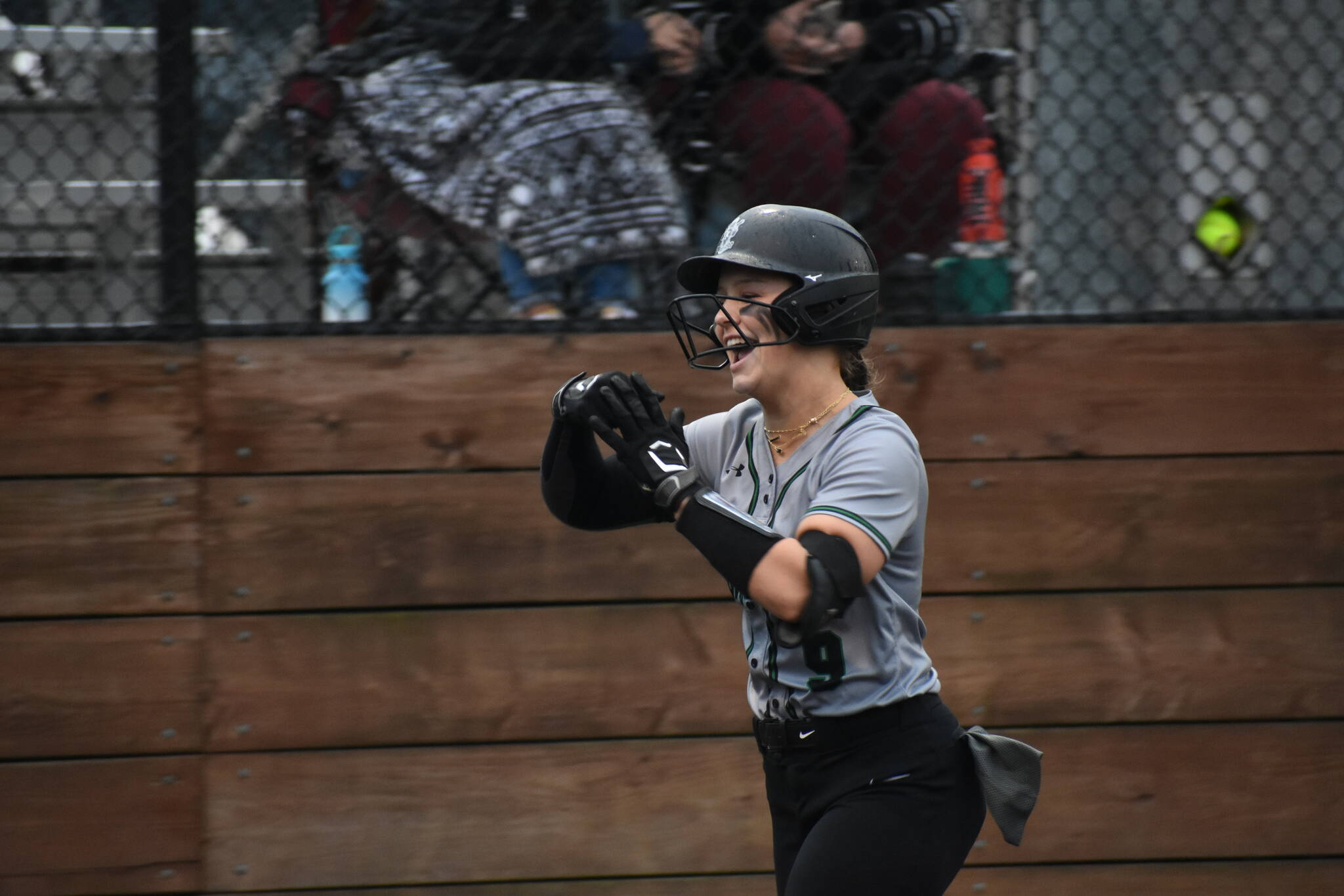 Sarah Wright gives a big smile after her home run. Ben Ray / The Reporter