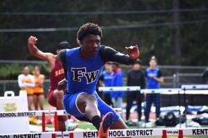 Sam Wah leaps over the hurdles en route to winning his race. Ben Ray / The Mirror