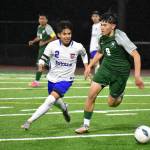 Saul Rodriguez chases down an Auburn player in the second half. Ben Ray / The Reporter