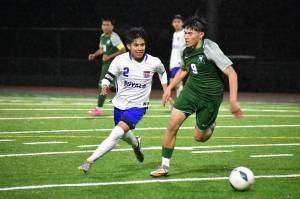 Saul Rodriguez chases down an Auburn player in the second half. Ben Ray / The Reporter