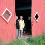 Sharon Bersaas and Nancy Simpson during a 2016 tour of the Dvorak Barn along the Green River in Kent that the women helped save. FILE PHOTO, Kent Reporter