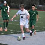 Cole Maginnis looks to avoid the slide tackle from Kentridges Tristan Nemeth. Ben Ray / The Reporter