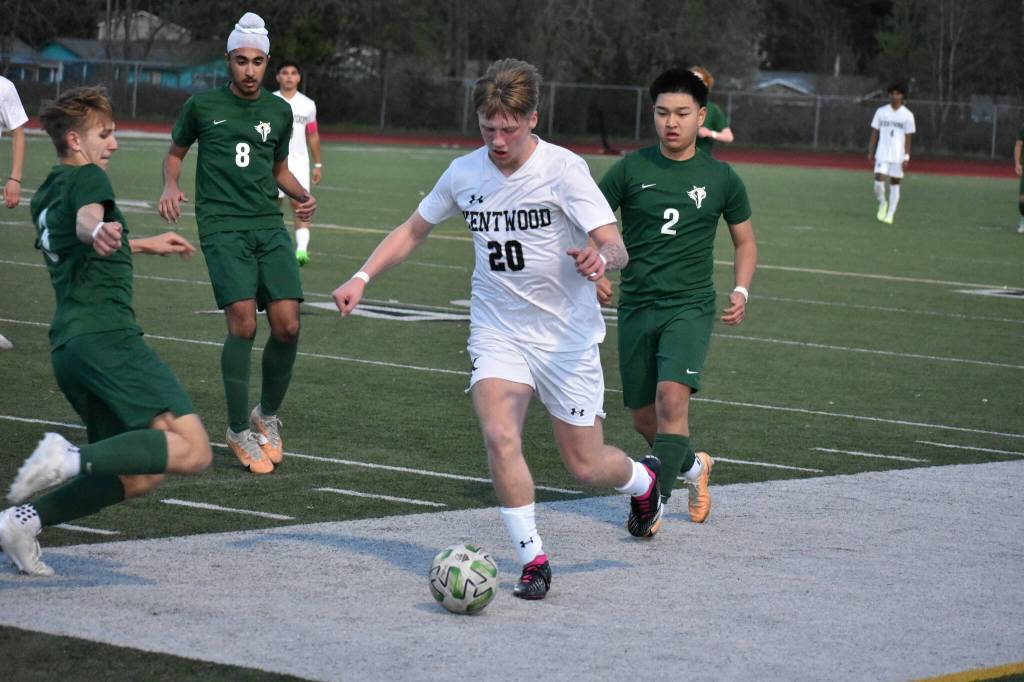 Cole Maginnis looks to avoid the slide tackle from Kentridges Tristan Nemeth. Ben Ray / The Reporter