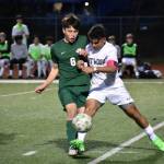 Seth Thomas and Isaiah Shimizu contest for possession of the ball. Ben Ray / The Reporter