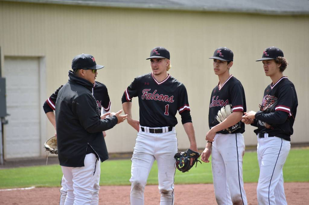 Kentlakes infield meets during a pitching change. Ben Ray / The Reporter