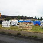 Asylum seekers set up camp Saturday, June 2, in Kent next to the former Econo Lodge, now vacant and owned by King County. Asylum seekers want the county and city of Kent to reopen the hotel for them. BAILEY JO JOSIE, Sound Publishing