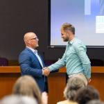 Kentwood High School cross country and track coach Stewart Kunzelman is recognized for his coaching efforts. Photo by Robby Mullikin