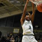 Jaylen Petty dunks early in the season for the Trojans. Ben Ray / The Reporter