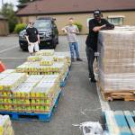 Volunteers help unload a semi of donated food for local organizations. COURTESY PHOTO