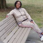 Selena Taylor on the bench that honors her son Ezra Taylor, who was killed by gun violence in 2021. Photo by Keelin Everly-Lang / The Mirror.