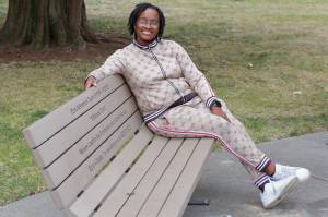 Selena Taylor on the bench that honors her son Ezra Taylor, who was killed by gun violence in 2021. Photo by Keelin Everly-Lang / The Mirror.