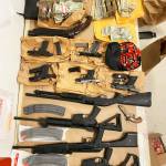 Guns and cash seized by federal law enforcement officers in 2022 as part of a drug trafficking ring bust in Washington and California that resulted in 17 indictments on drug charges. COURTESY PHOTO, FBI