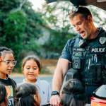 Kent Police Officer J. Berry interacts with children at a National Night Out event Tuesday, Aug. 6. COURTESY PHOTO, City of Kent