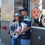 Rodina Bumanglag (left) of Renton and Reggie Tagalicod of Las Vegas arrived at 8 a.m. to meet Bobby Wagner and Richard Sherman at the grand opening of Crumble Cookies in Renton. Bumanglag said that she has been a Seahawk fan for a couple years and wanted to come out and support Wagner. Photo by Bailey Jo Josie/Sound Publishing.