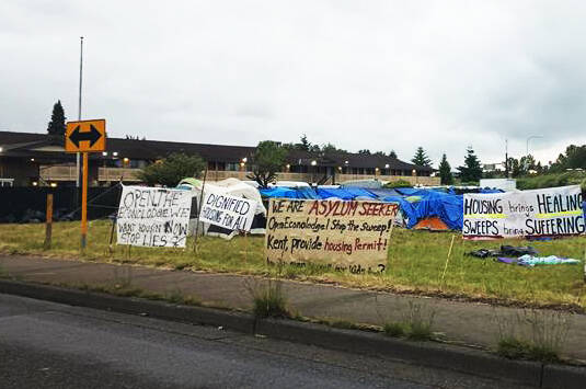 Asylum seekers set up came next to the former Econo Lodge in June on King County property. County officials and partners found housing for the asylum seekers and closed the encampment Sept. 24. FILE PHOTO, Kent Reporter
