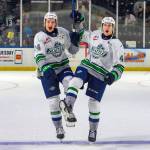 Brayden Holbertson (left) and Owen Boucher (right) celebrate the home opening win for the first of the season. Photo taken by Brian Liesse / The Seattle Thunderbirds