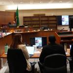 Corniche Washington in the black suit between his defense while the prosecutor delivered her closing statement. Photo by Joshua Solorzano/The Mirror