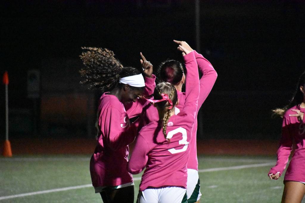 Three Chargers all dance after Shiney Mayanja scored her first goal of the night, Kentridges fifth. Ben Ray / The Reporter