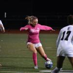 Mckenna Bennett in the middle of a pass to Shiney Mayanja for the Chargers sixth goal of the night. Ben Ray / The Reporter