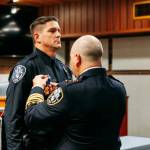 Kent Police Chief Rafael Padilla gives Officer Taylor Burns the Kent Police Department Medal of Honor for his heroic efforts during the rescue of a seaplane pilot in Lake Meridian. COURTESY PHOTO, Kent Police