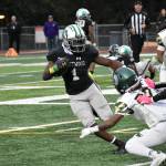 Senior running back Antoine Lee avoids a Trojan defender early in the game against Auburn. Ben Ray / The Reporter