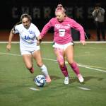 Makenna Bennett takes on a Tahoma player in a fight for possession. Ben Ray / The Reporter